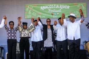 Group of African American performers on stage of Anacostia River Festival