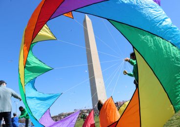 rainbow kite at Washington monument at blossom kite festival